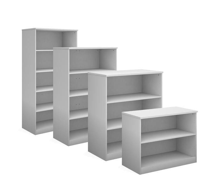 four white bookcases of different sizes